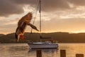 Lake District Sunset with Duck Flying. Boat in background Royalty Free Stock Photo