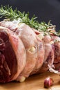 Raw rolled and tied Herdwick Sheep lamb joint prepared with garlic, rosemary and sea salt Royalty Free Stock Photo