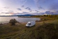Lake drone aerial view of a camper van with solar panel living van life mountain panorama landscape at sunset in Marateca Dam in