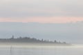 A lake at dusk, with beautiful, warm tones in the sky and water Royalty Free Stock Photo