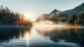Lake in the early morning fog with sun and mountain view Royalty Free Stock Photo