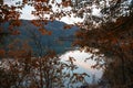 Lake Eibsee bavaria, view through autumnal branches Royalty Free Stock Photo