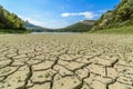 Lake eleshnitsa with cracked mud pattern in foreground