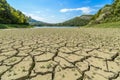 Lake eleshnitsa with cracked mud pattern in foreground Royalty Free Stock Photo