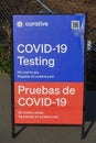 Lake Elsinore, CA, USA - April 4, 2022: Free COVID-19 testing. Drive through testing clinic sign on a road. Royalty Free Stock Photo