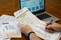 Lake Elsinore, CA, USA - May 30,2022: Close up of man filling out 2022 California Primary Election Ballot.