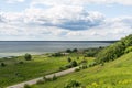 Lake, empty road, hill and plain. Royalty Free Stock Photo