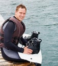 Lake, fitness and portrait of man with wakeboard for surfing, exercise and recreation hobby outdoors. Equipment, extreme Royalty Free Stock Photo