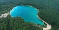 Lake in the forest with blue water