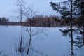 Lake in forest. Winter. Snow. Sunset.