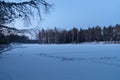 Lake in forest. Winter. Snow. Sunset.