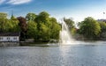 A lake fountain at Byparken park in Stavanger city downtown, early morning on Constitution Day