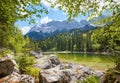 Lake Frillensee Grainau, view to Zugspitze mass at springtime, upper bavarian landscape