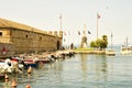 Lake of Garda. the port of the beautiful town of Lazise with modern toutistic boars and historical buildings