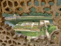 Lake with gardens seen from a lattice in the highest part of the Amber fort in Jaipur, India