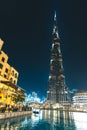 Lake with gondola in front of Burj Khalifa Dubai - UAE Royalty Free Stock Photo