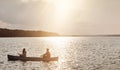 The lake is always a great getaway. a young couple rowing a boat out on the lake. Royalty Free Stock Photo