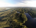 Lake in green summer forest with cloudy sky. Aerial view Russian Karelia. Sunset Royalty Free Stock Photo