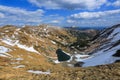 Lake at the high mountains. Sun rays enlighten the valley. Majestic spring scenery. Location place the Carpathian, Ukraine, Europe