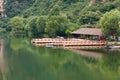 Lake house with pier and woods