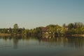 Lake house. house on the shore in the village. landscape with reflection on the water Royalty Free Stock Photo