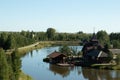 Lake house in a wooded area. Countryside life, farm near river. Landscape