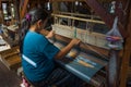 A Burmese woman weaves a fabric. Myanmar Burma Royalty Free Stock Photo