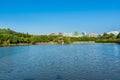 Lake, island,  green forest and Chinese traditional pavilion against blue sky in longtan Park, Longgang, Shenzhen, China Royalty Free Stock Photo