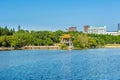 Lake, island,  green forest and Chinese traditional pavilion against blue sky in longtan Park, Longgang, Shenzhen, China Royalty Free Stock Photo