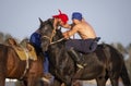 Nomad men wrestling on horseback Royalty Free Stock Photo