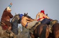 Nomad men wrestling on horseback Royalty Free Stock Photo