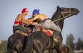 Nomad men wrestling on horseback Royalty Free Stock Photo