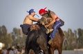 Nomad men wrestling on horseback Royalty Free Stock Photo