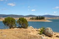 Lake Jindabyne, Australia with trees and rocks Royalty Free Stock Photo