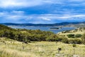 Lake Jindabyne landscape with overcast sky and rural foreground Royalty Free Stock Photo
