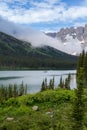 Lake Josephine in Glacier National Park as a boat passes by