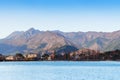 Lake Kawaguchiko shore line with hotel buildings and moutains in winter - Japan Royalty Free Stock Photo