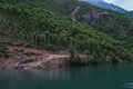 Lake Komani, Albania - May 18, 2017: Onboard morning Lake Komani ferry from Fierza to Koman in Albania - picking up people at a 