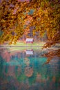 Lake Laghi di Fusine in autumn with a small hut Royalty Free Stock Photo