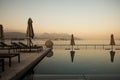 Lake - Lago Maggiore, Italy. Infinity swimming pool in Stresa by sunset light