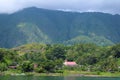 Lake landscape blue water, hill view from the top. Clear sky with green wood. Large panorama while travelling Royalty Free Stock Photo