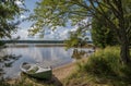 Lake landscape in Finland, boat and beach Royalty Free Stock Photo