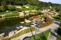 Lake in landscaped park in Japanese style. Beautiful landscape design, lake, wooden gazebos, red bridge. Aerial view of park from Royalty Free Stock Photo