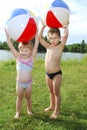 The lake a little boy and girl playing with an inflatable ball Royalty Free Stock Photo