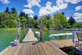 Lake with long wood pier and private party raft. Royalty Free Stock Photo
