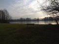 Lake with a lonley bench Royalty Free Stock Photo