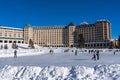 Tourists skating on the Fairmont Chateau Lake Louise winter ice skating rink.