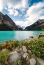 Lake Louise with rocky mountains on turquoise lake and blue sky in Banff national park Royalty Free Stock Photo