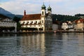 Lake Lucerne waterfront with historic buildings, iron bridge and Jesuitenkirche