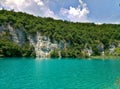 The lake with luminous azure-colored water. Greenery and rocks. Plitvice Lakes, Croatia Royalty Free Stock Photo